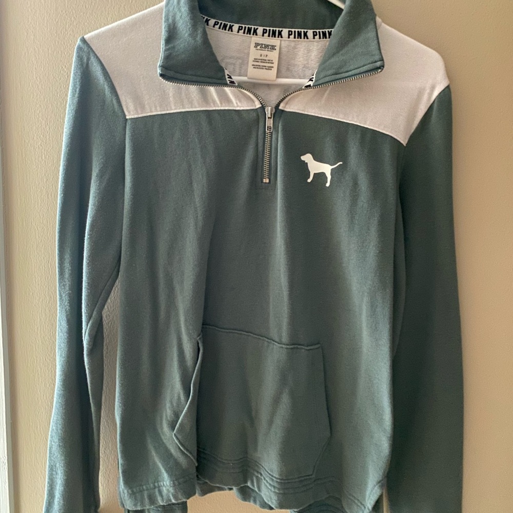 mint green colored half zip with writing/logo:)